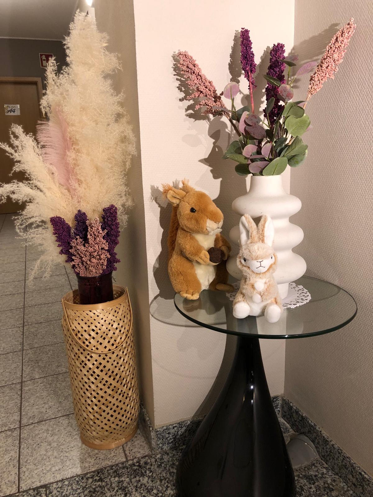 Hallway detail with flowers and soft toys